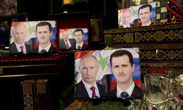 Сувеніри, що продають в Сирії: портрети путіна та башара асада разом. Джерело: theguardian.com