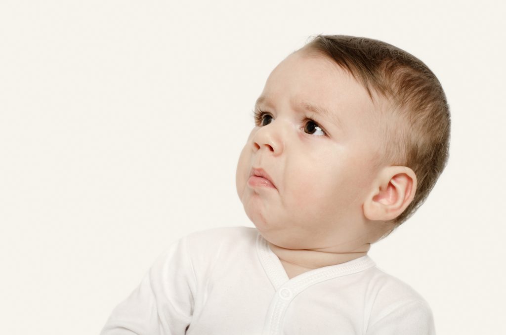Baby looking disgusted.