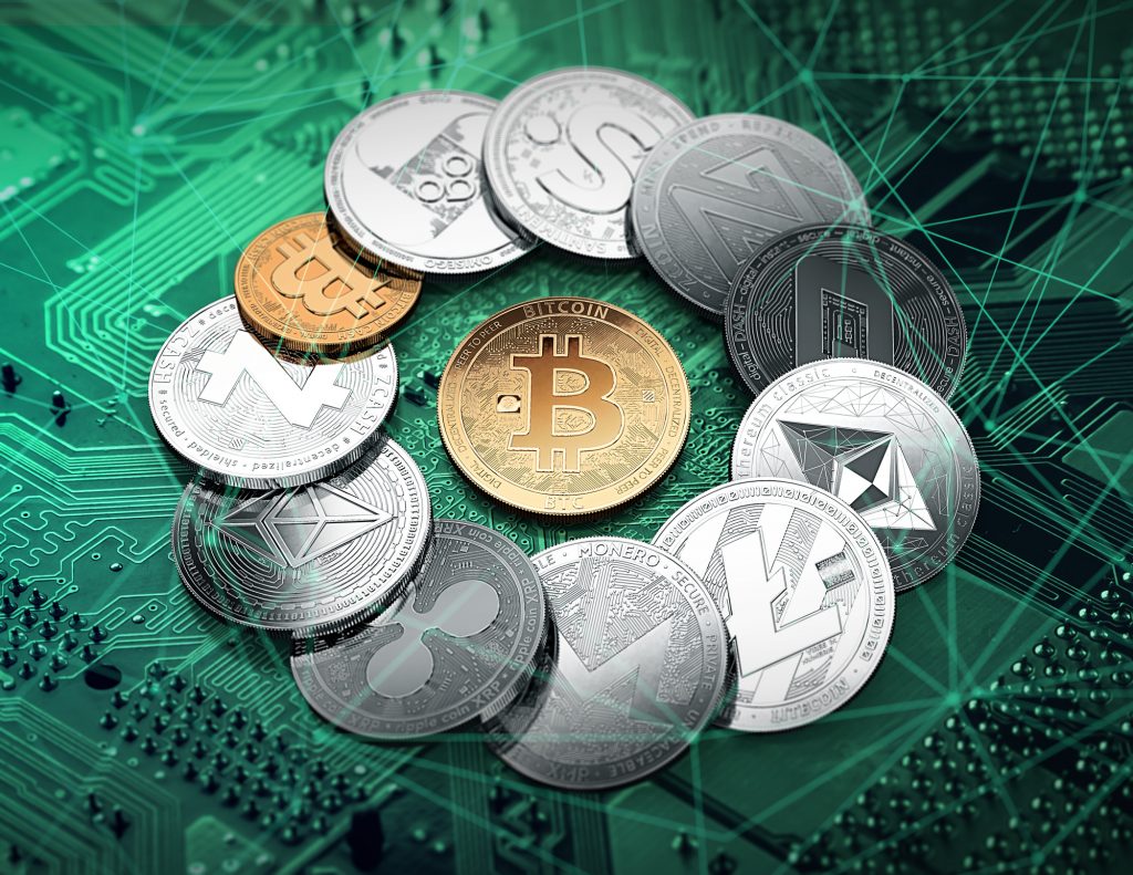 Different cryptocurrencies in a circle with a golden bitcoin in