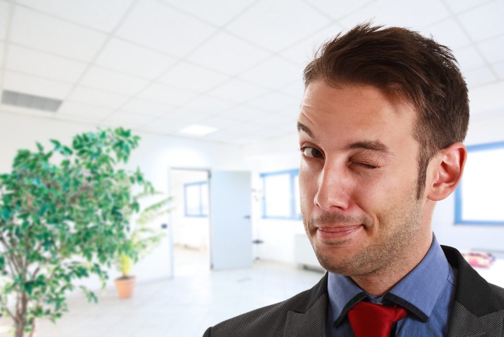 Winking businessman portrait