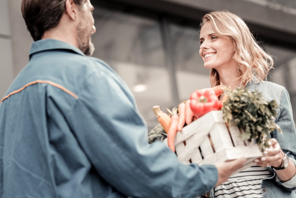 Delighted joyful woman taking her order
