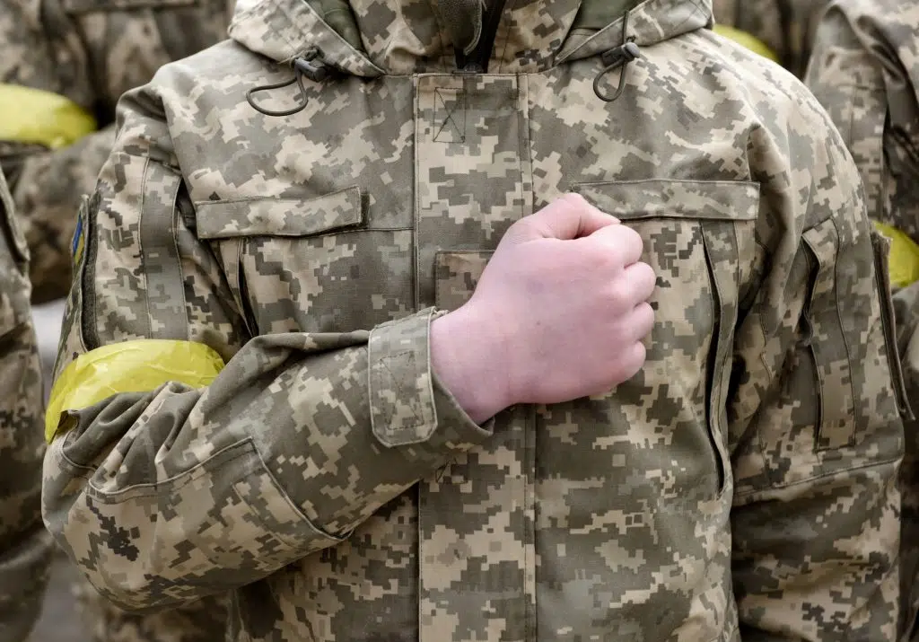 Ukrainian soldiers stand during funerals ceremony
