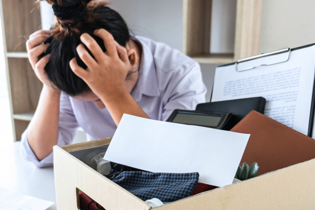 Upset woman at work desk