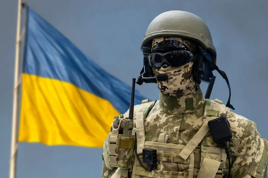 Soldier with flag of Ukraine. Ukrainian soldier