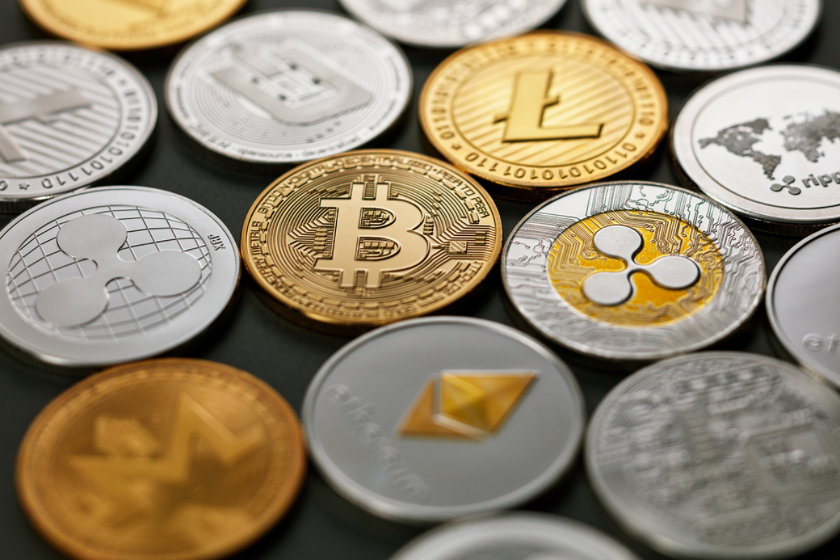 Various cryptocurrency coins on the table