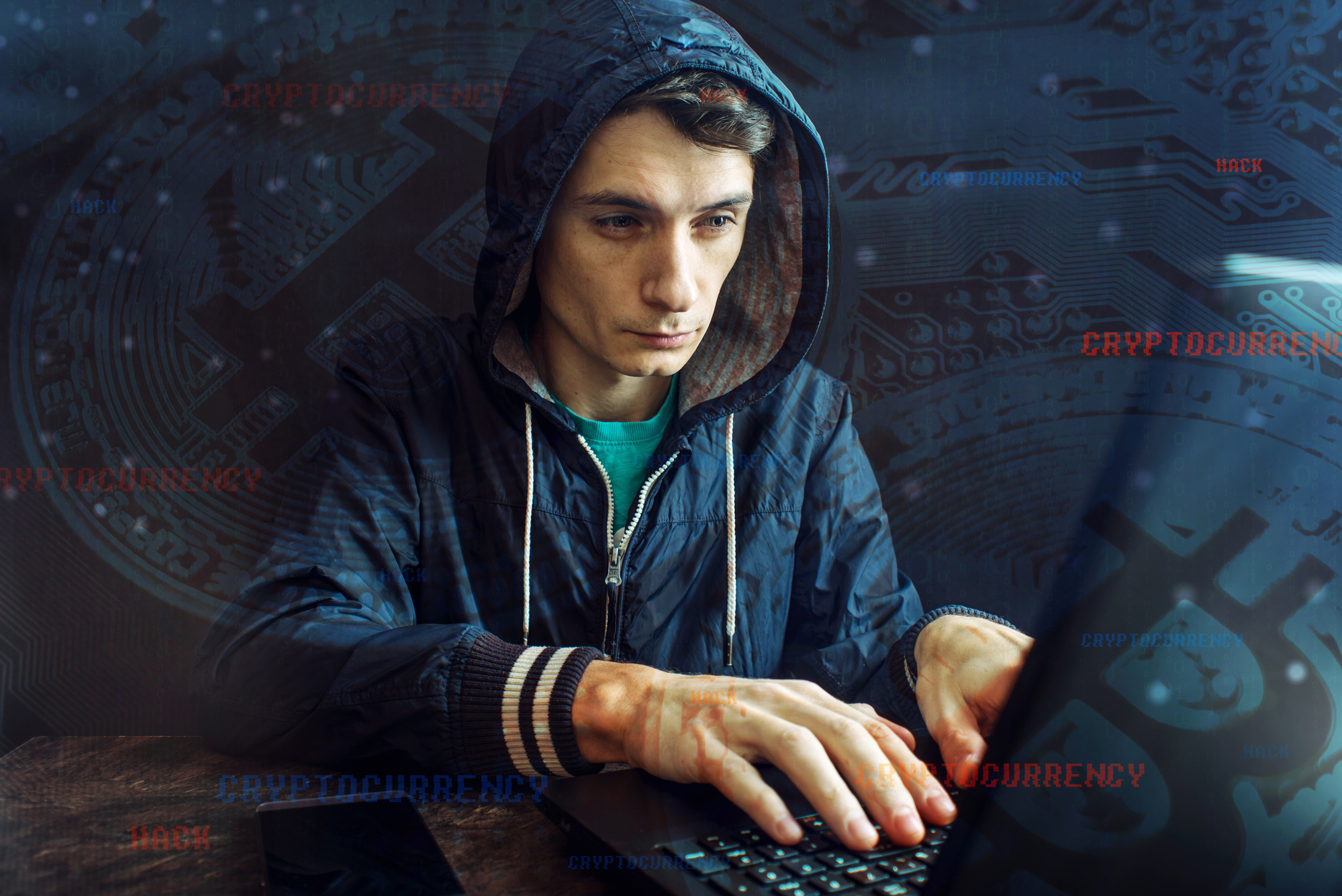 Hacker with a face is trying to steal cryptocurrency using a computer. Fraud at Cryptojacking