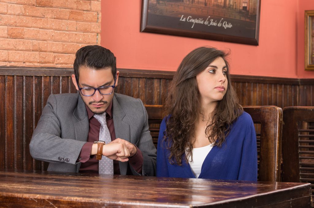 young couple waiting for the waiter in a restaurant