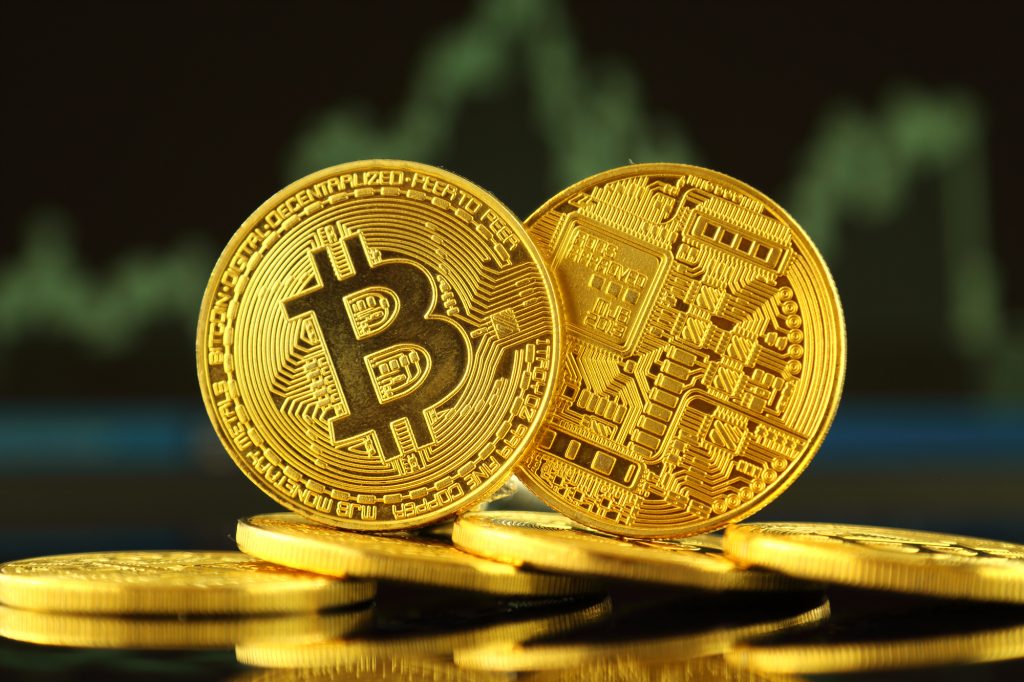 Physical version of Bitcoin, new virtual money. Conceptual image for worldwide cryptocurrency and digital payment system called the first decentralized digital currency.