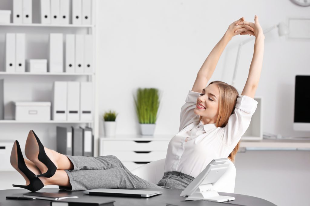 Young businesswoman relaxing in office
