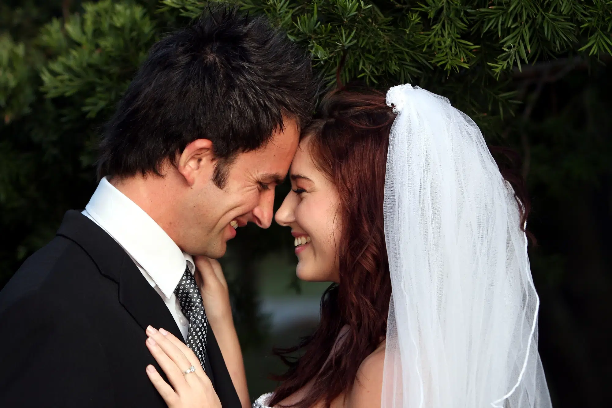 Happy wedding couple sharing an intimate moment