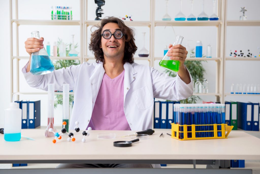 The funny male chemist working in the lab