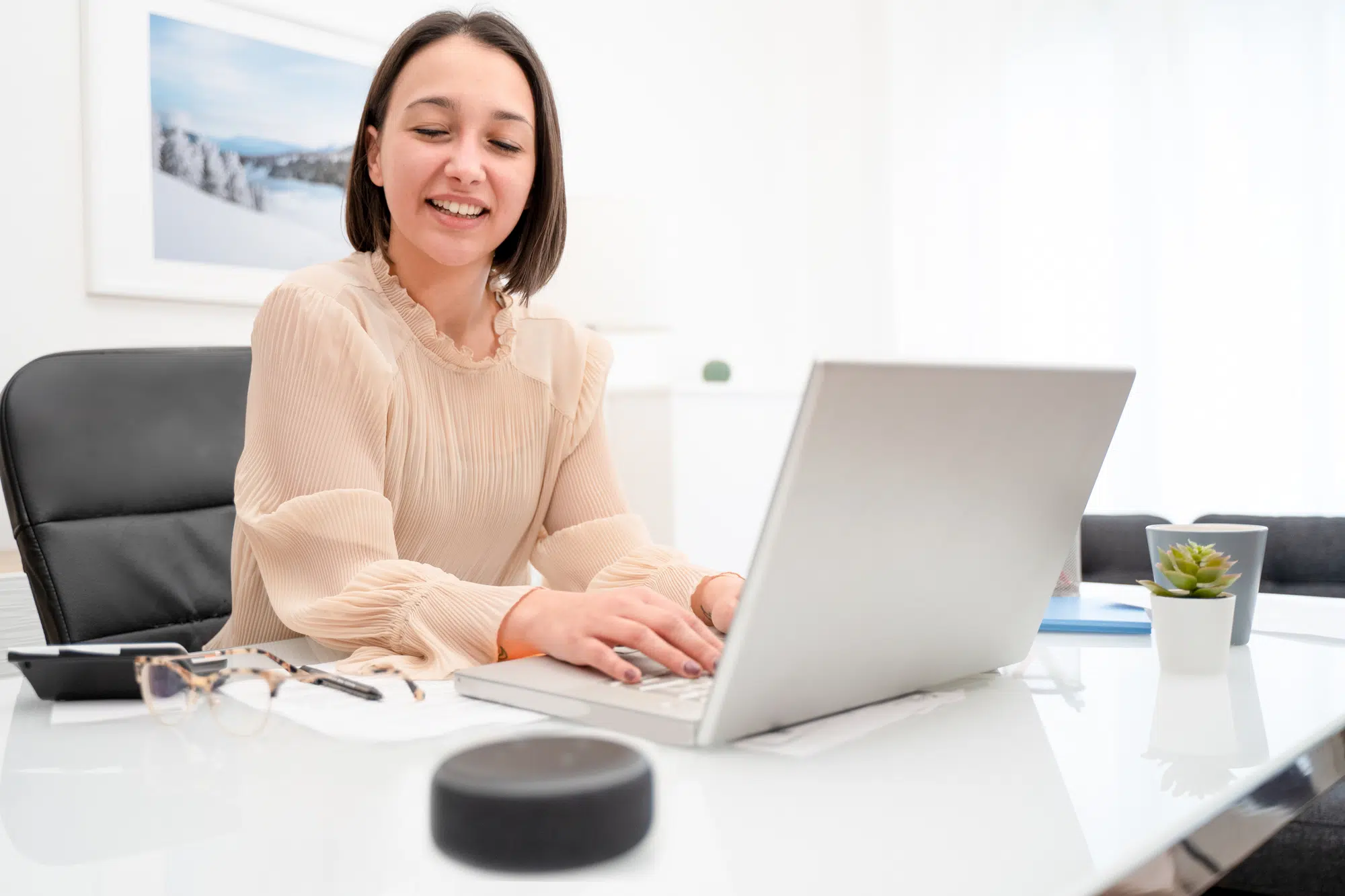 Cheerful happy woman talking to voice assistant