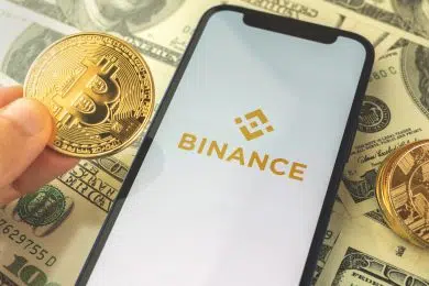 Kharkov, Ukraine - May 3, 2021: Binance buy and sell crypto currency app on the screen with bitcoin background
