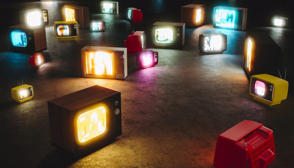 vintage televisions turned on the floor. Nobody around. 3d render. concept of mass media and tv addiction.