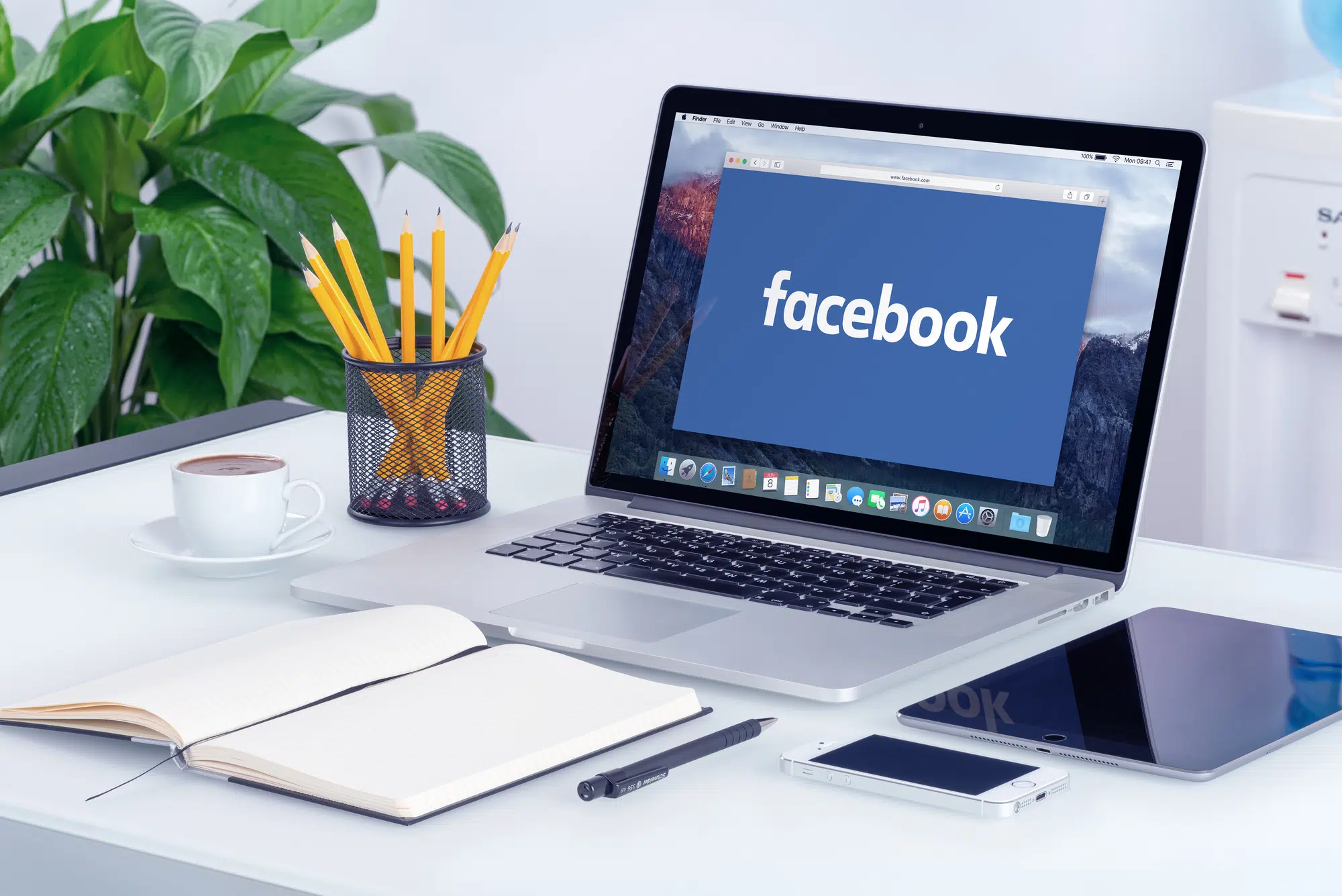 Facebook new logo on the Apple MacBook Pro Retina with an open tab in Safari browser that is on office desk. Facebook is the most popular social network in the world. Varna, Bulgaria - May 29, 2015.