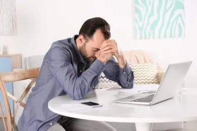 Handsome depressed man at home