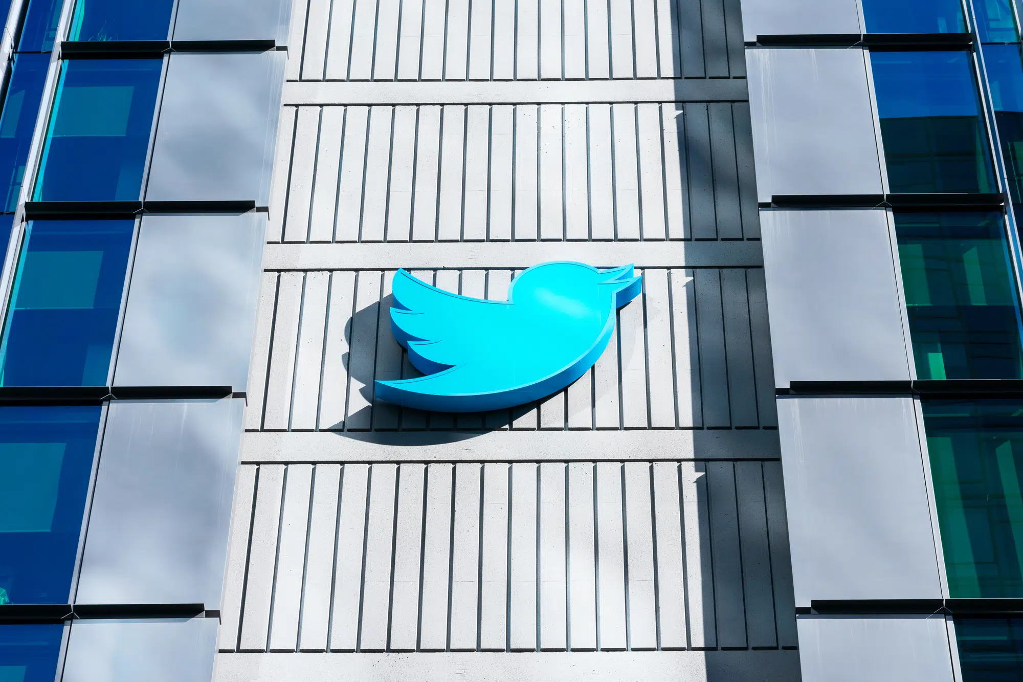 Twitter Bird logo on HQ building in downtown. Twitter is an American microblogging and social networking service - San Francisco, California, USA - 2020