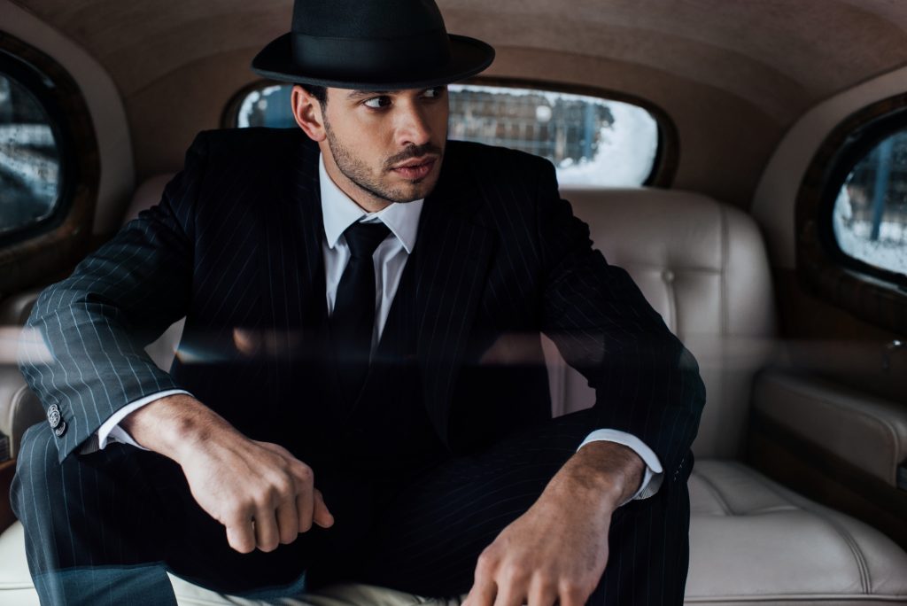 A man in the role of a mafia boss