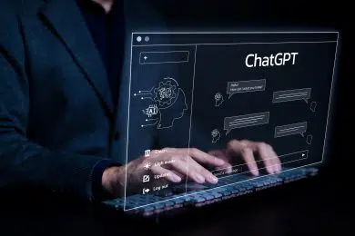 ChatGPT, Chat with AI or Artificial Intelligence technology. Man using a laptop computer chatting with an intelligent artificial intelligence asks for the answers he wants. Smart assistant futuristic,