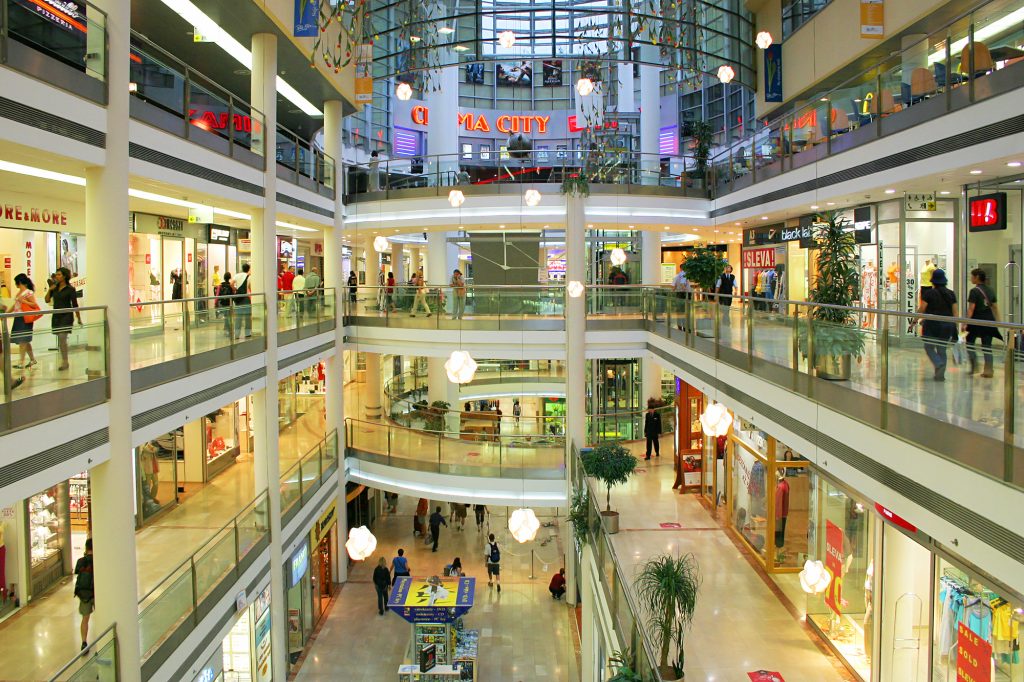 PRAGUE - JULY 07: Palac Flora shopping mall interior. Opened in 2003, contains 4 floors, 120 shops, Cinema City & IMAX theater. This is one of the largest malls in Prague, Czech Republic on July 07, 2004.