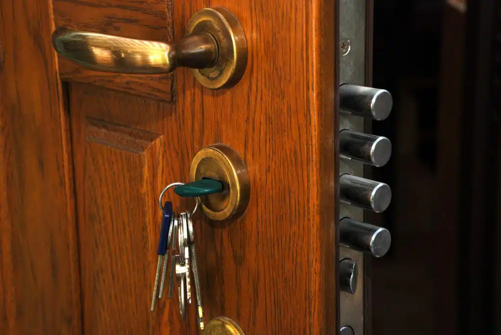 close-up safe lock in the open home wood door