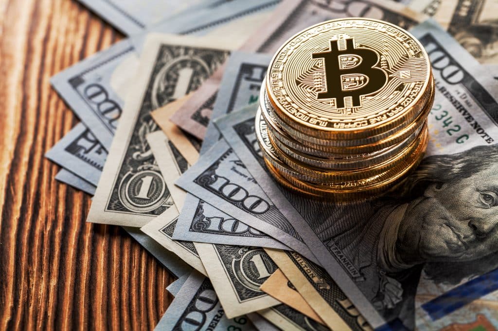 golden bitcoin on wood background
