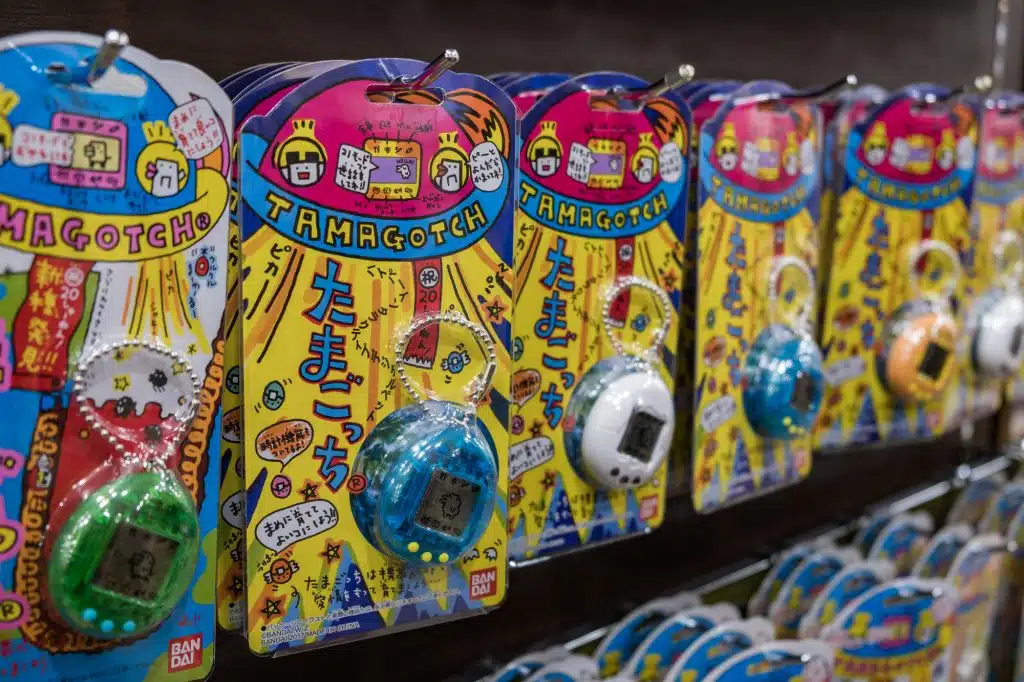 TOKYO, JAPAN - 12 FEB 2018: Tight shot of Tamagotchi electronic retro virtual pet from the nineties in blue and white