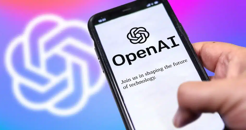 San Francisco US, Dec 2022: A hand holding a phone with the OpenAI website on the screen. Colorful background with blurred logo. OpenAI is a non-profit artificial intelligence research organization.