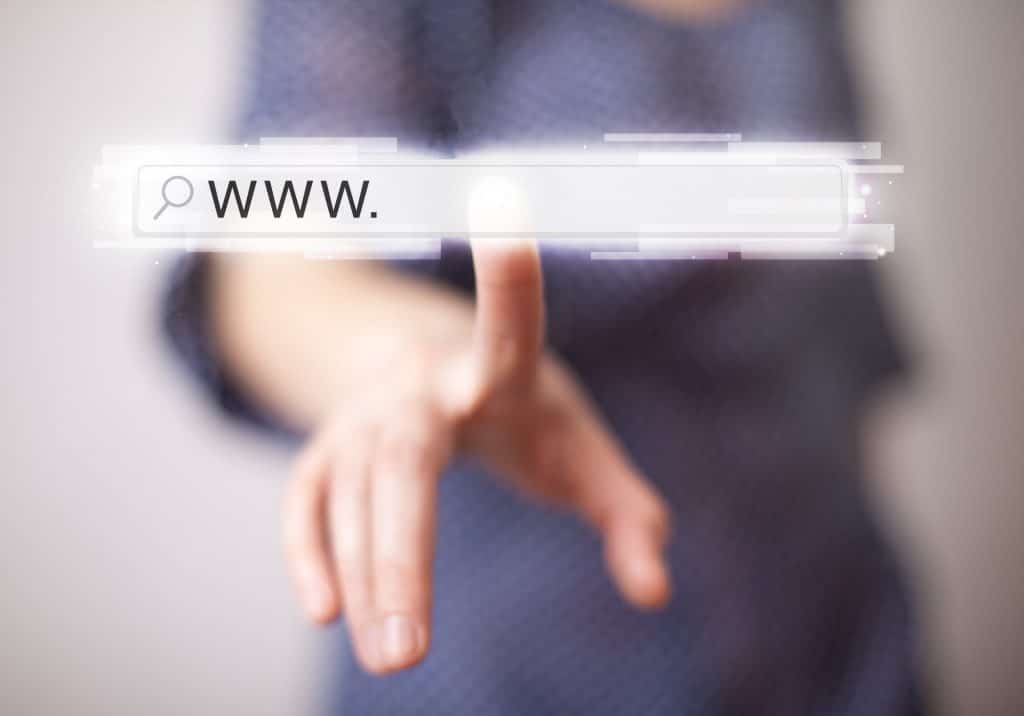 Young woman touching web browser address bar with www sign