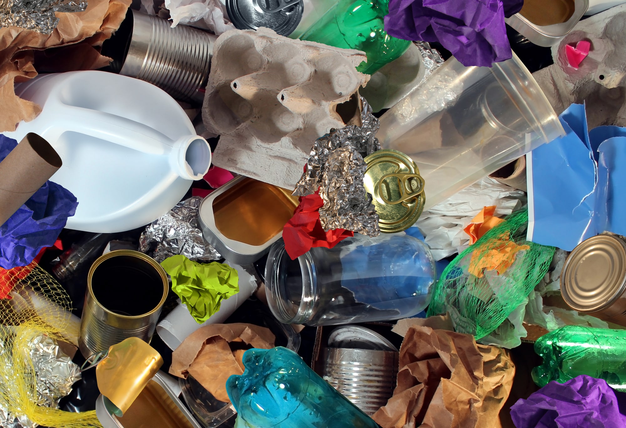 Recycling garbage and reusable waste management as old paper glass metal and plastic household products to be reused as a concept of environmental conservation of material saving energy and money.