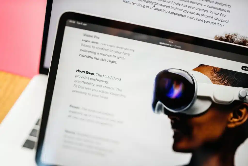 Paris, France - Jun 6, 2023: Tilt-shift focus on the Head Ban providing cushioning, breathability, and stretch - Creative room table with webpage of Apple on iPad Pro showcasing Apple Vision Pro mixed reality XR headset. Priced 3,499 USD - future of computing