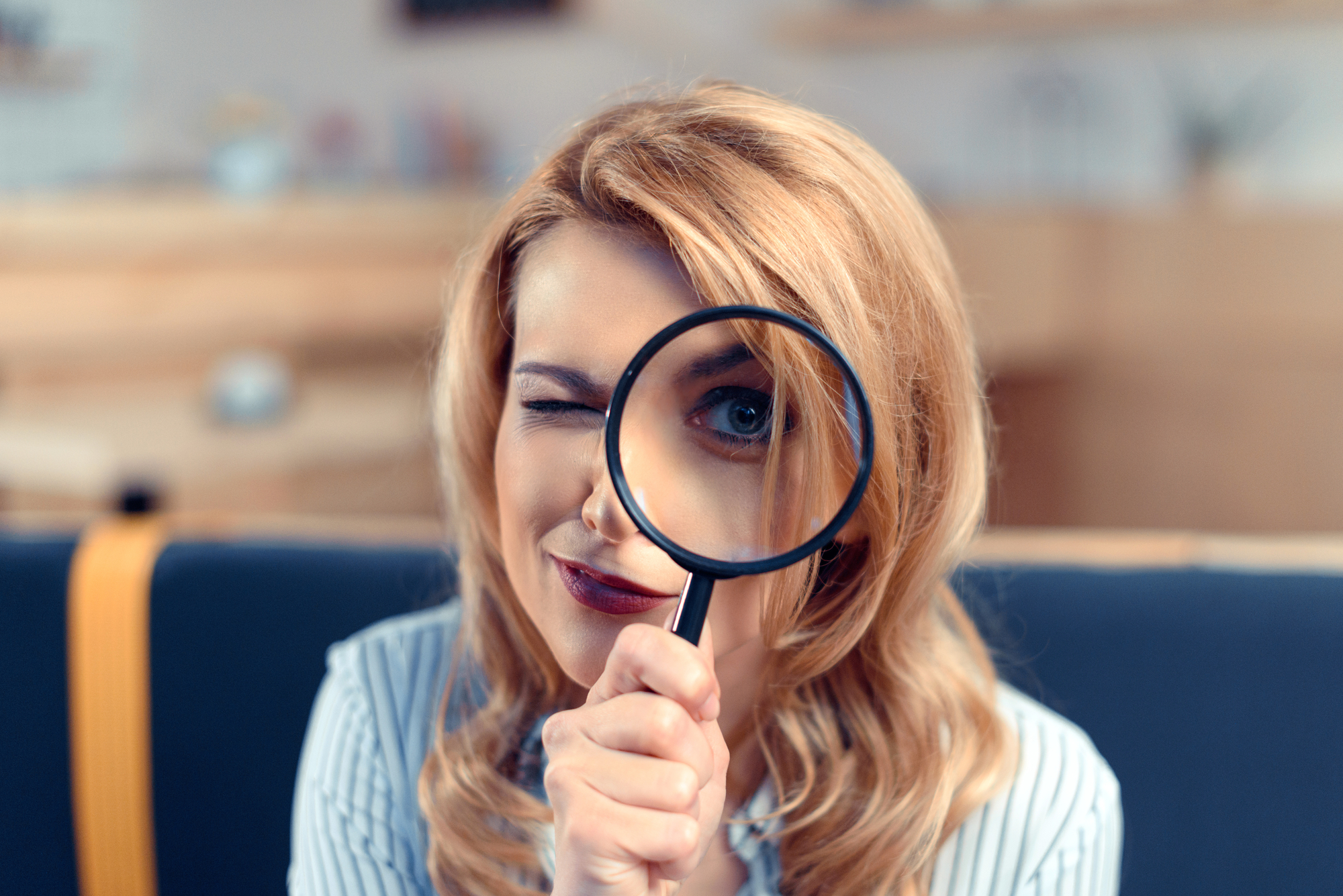Woman with magnifying glass