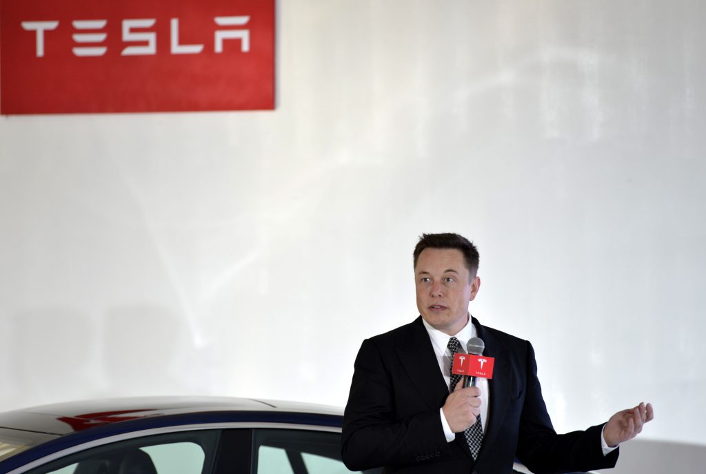 Tesla CEO Elon Musk speaks during a press conference for Tesla Firmware 7.0 in Beijing, China, 23 October 2015. Luxury electric-car maker Tesla Motors Inc. is in discussions with state and national government officials about producing its $76,000 and up vehicles in China, where the government is vigorously promoting reduced-emissions vehicles. The car maker said it hopes to make a definitive announcement resulting from those discussions soon. Chief Executive Elon Musk said local production could cut sales prices of Tesla cars in China by a third, thanks to reduced shipping costs and avoidance of import duties. He earlier in 2015 told official Xinhua News Agency that Chinese production could be possible "within three years." Mr. Musk's remarks were made at a forum on Thursday at Tsinghua University in Beijing.