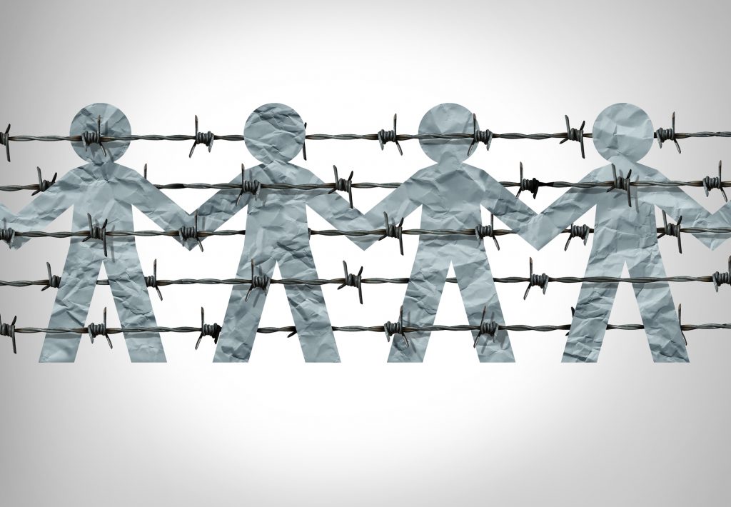 Immigration social issue as a symbol for migration laws and refugees as barbed wire with paper cut people icons behind a border fence representing challenges of entering a country and becoming a citizen in a 3D illustration style.