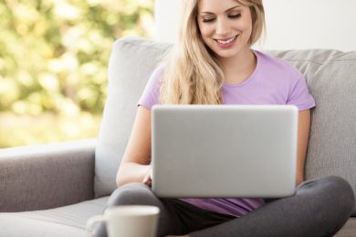 young beautiful woman using a laptop computer at home