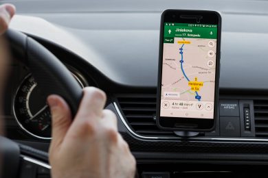 LOS ANGELES, CALIFORNIA - JUNE 6, 2019: Close up to male driving and using navigation appliction Google Maps. Get direction. An illustrative editorial image.