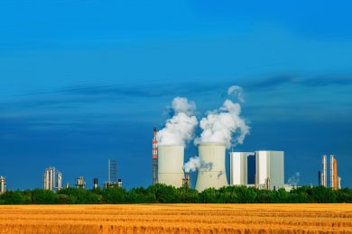 Power engineering and electric power generation concept. Cooling Tower and thermal power station. In thermal power station heat energy is converted to electric power. Horizontal image.