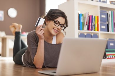 Happy woman doing online shopping at home