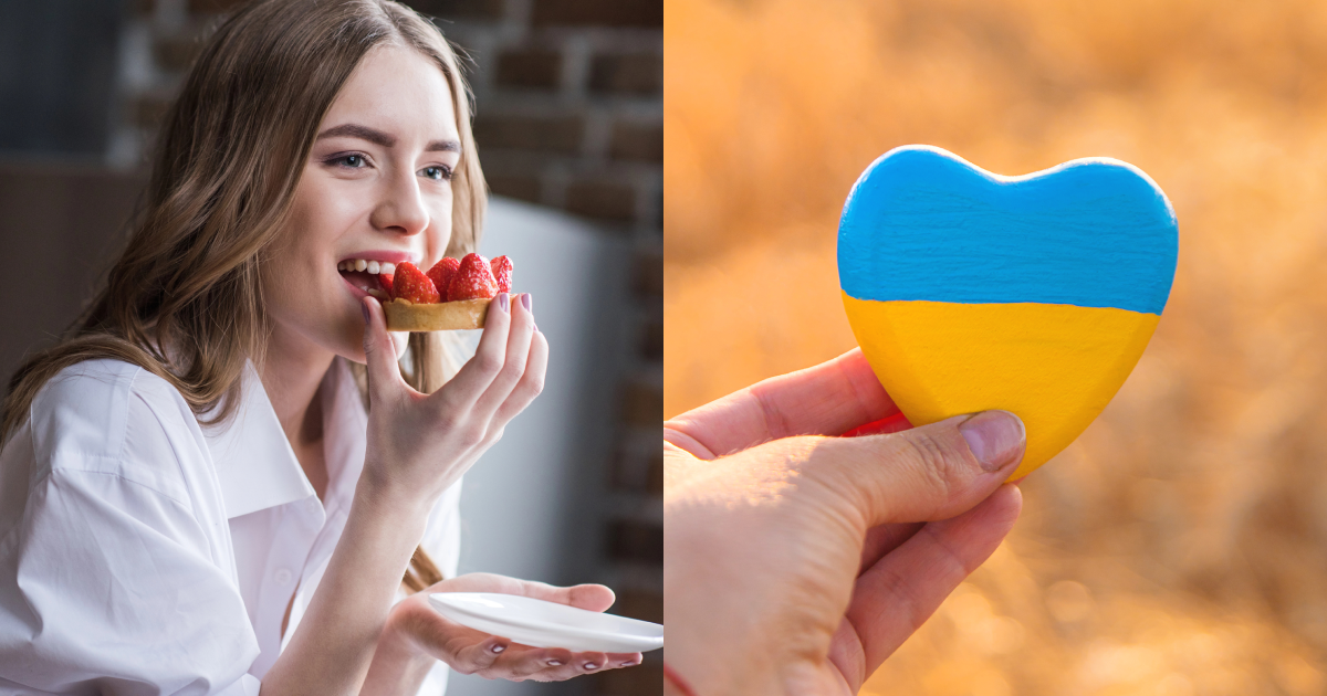 дівчина їсть смаколик, серце в кольорах українського прапора